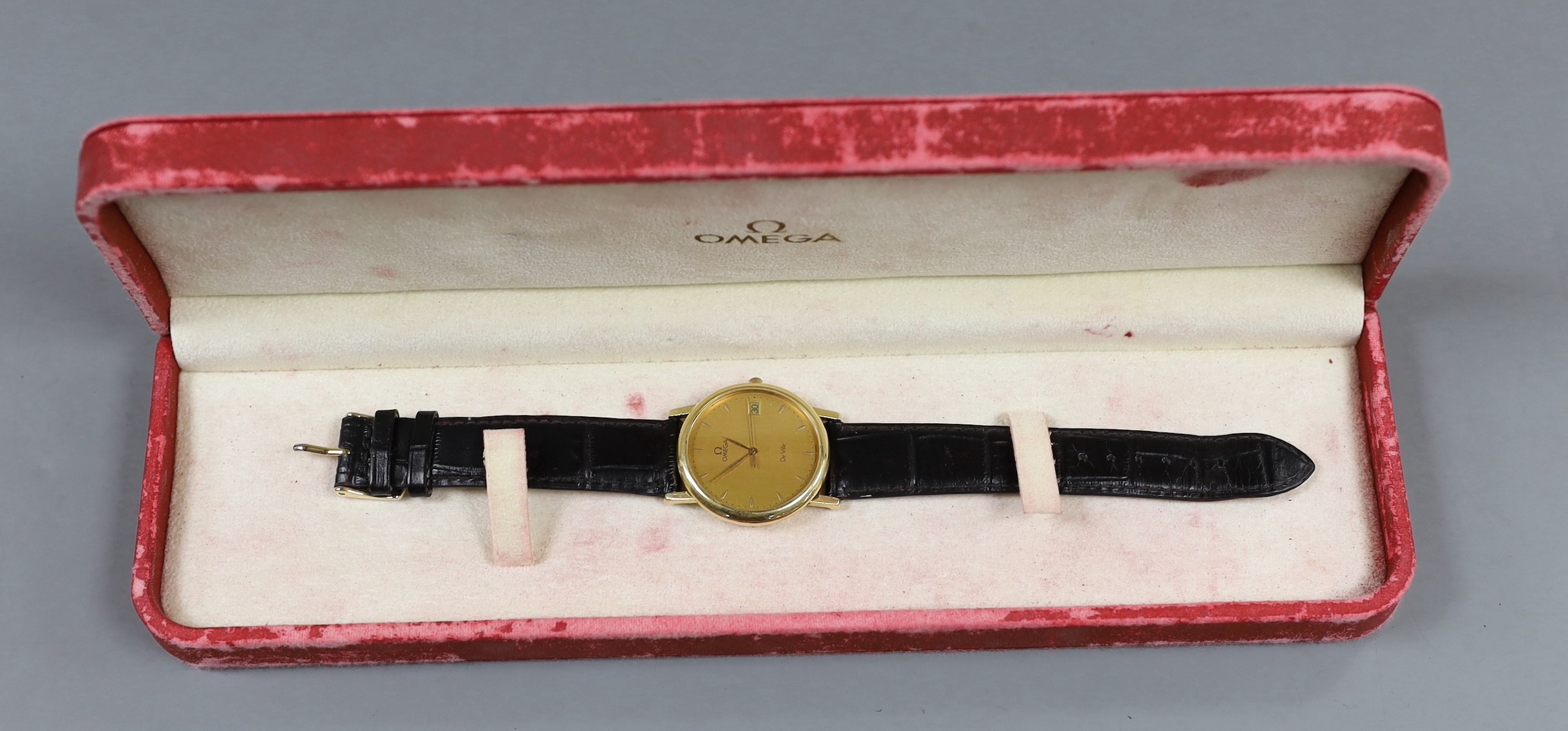 A gentleman's 18ct gold Omega De Ville quartz wrist watch, on associated leather strap, with Omega box.